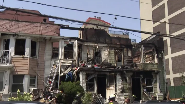 1 dead, nearly 2 dozen hurt after Queens fire spreads to 3 buildings, officials say
