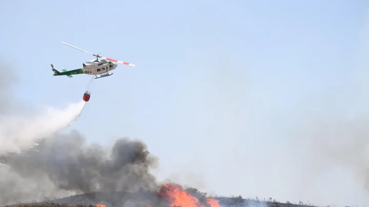 Hundreds of firefighters in Spain battle deadly wildfires that killed at least 12 fleeing flames